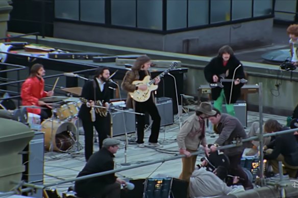 The Beatles play on a rooftop in Saville Row in 1969.