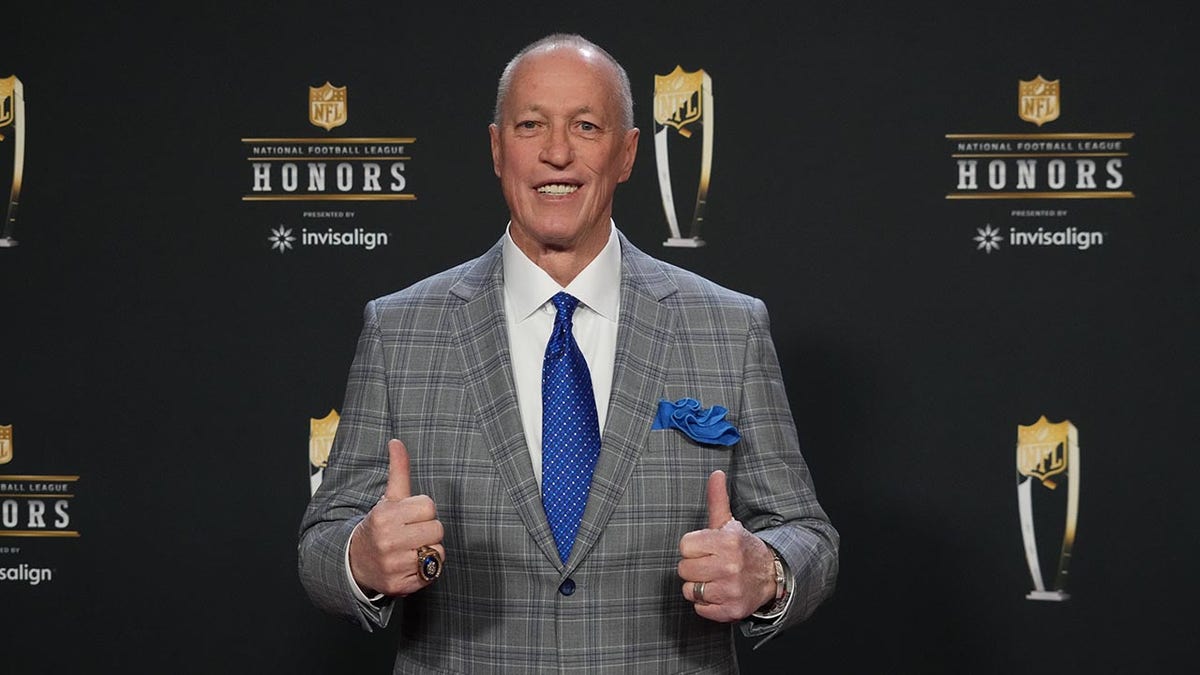 Former Buffalo Bills quarterback Jim Kelly posing on the red carpet at Symphony Hall.