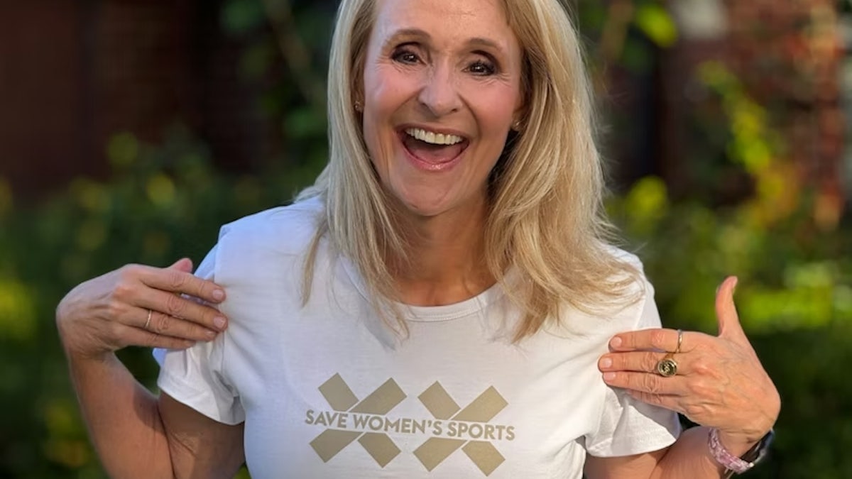 Olympic gold medalist Nancy Hogshead smiling and posing