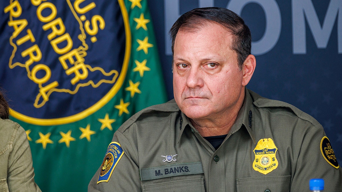 U.S. Border Patrol Chief Mike Banks standing and speaking.