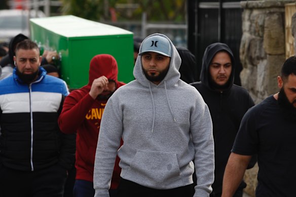 Ibrahem Hamze (in grey hoodie) at the funeral of his brother Bilal, was allegedly the target of a murder plot.