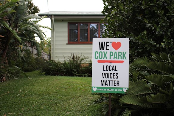 Many homes surrounding Cox Park had erected signs calling for further consultation on Sunday. 