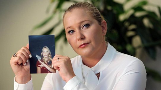 Virginia Giuffre with a photo of herself as a teen, when she was trafficked by Jeffrey Epstein.