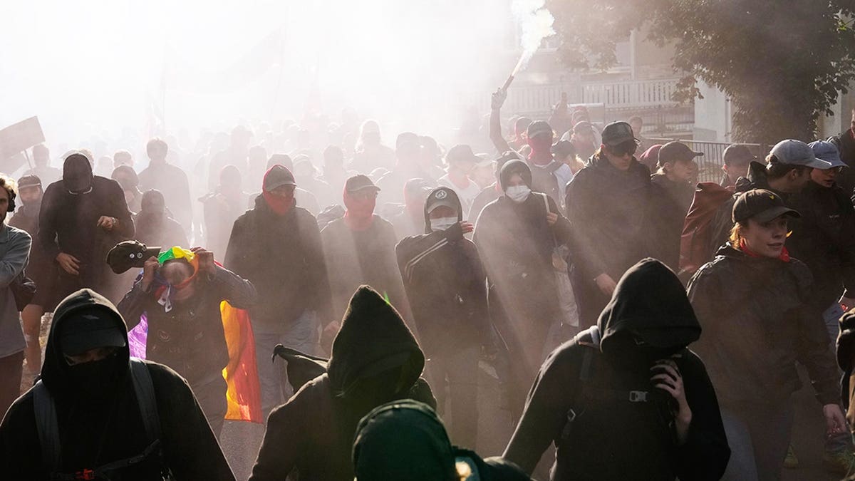 Protesters gather before a party convention of Alternative for Germany, or AfD in Erfurt, Germany, Saturday, July 4, 2026.
