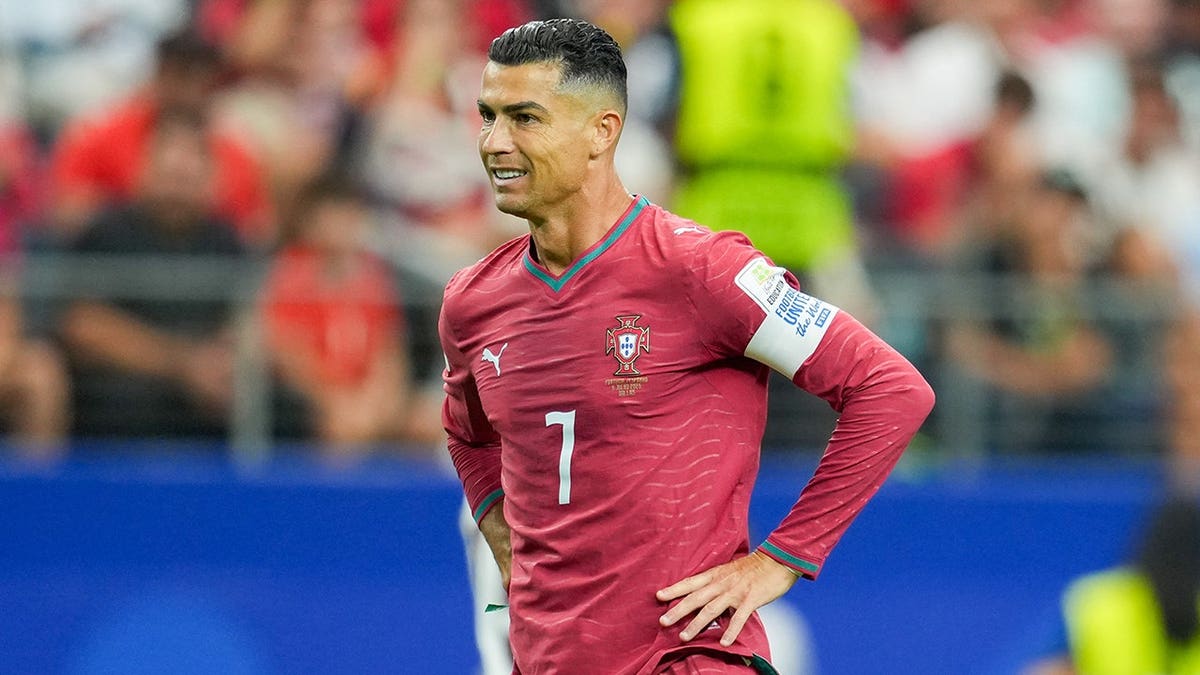 Cristiano Ronaldo looks on pitch