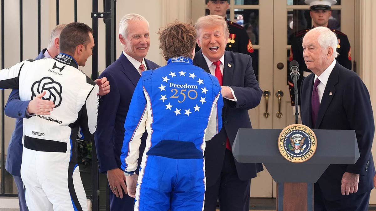 President Donald Trump speaks with Alex Palou at the White House.