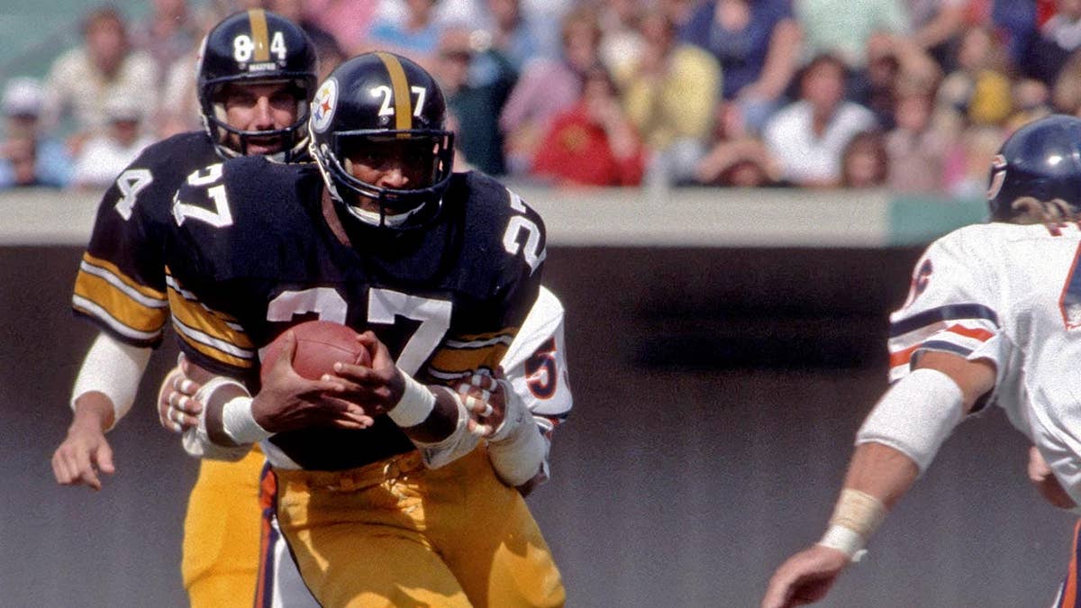 Greg Hawthorne runs with the football as he is tackled during a game in Pittsburgh.