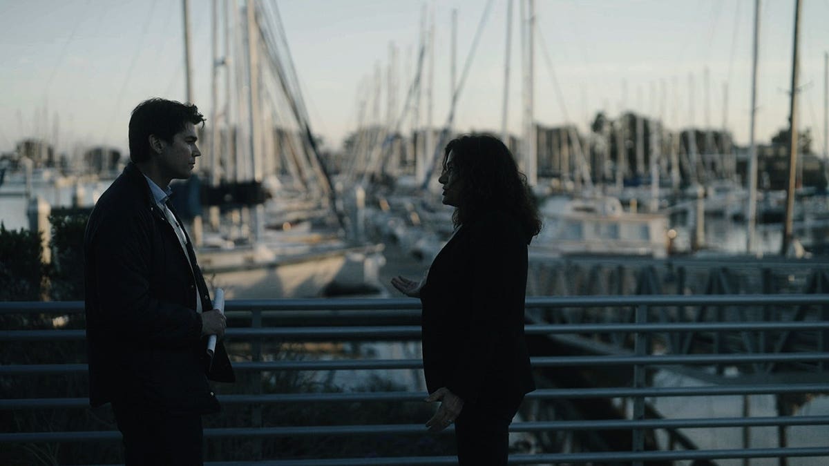 Ninette Toosbuy being interviewed at a marina.
