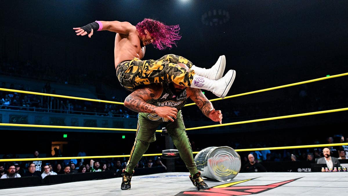 KC Navarro and AJ Francis in a match