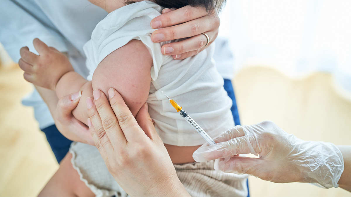 Doctor giving a vaccine to a baby
