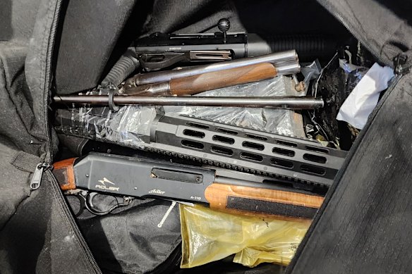 Several firearms and gun parts were discovered in a black duffle bag hidden in the alleged safehouse.