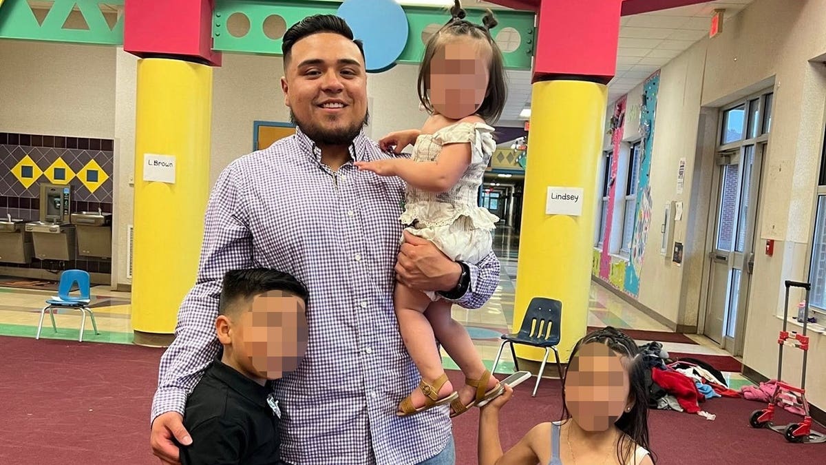 Jose Felix Alvarez-Duenas with his three children