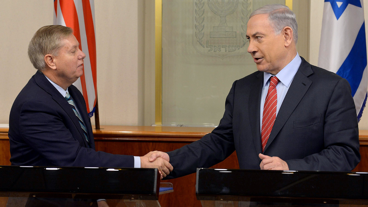 United States Senator Lindsey Graham shakes hand with Israeli Prime Minister Benjamin Netanyahu during a press conference in Jerusalem, Israel on December 27, 2014.