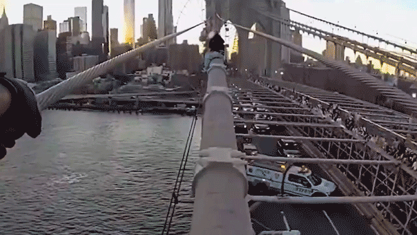 Dramatic bodycam captures NYPD officer rescuing woman from top of Brooklyn Bridge after emotional plea