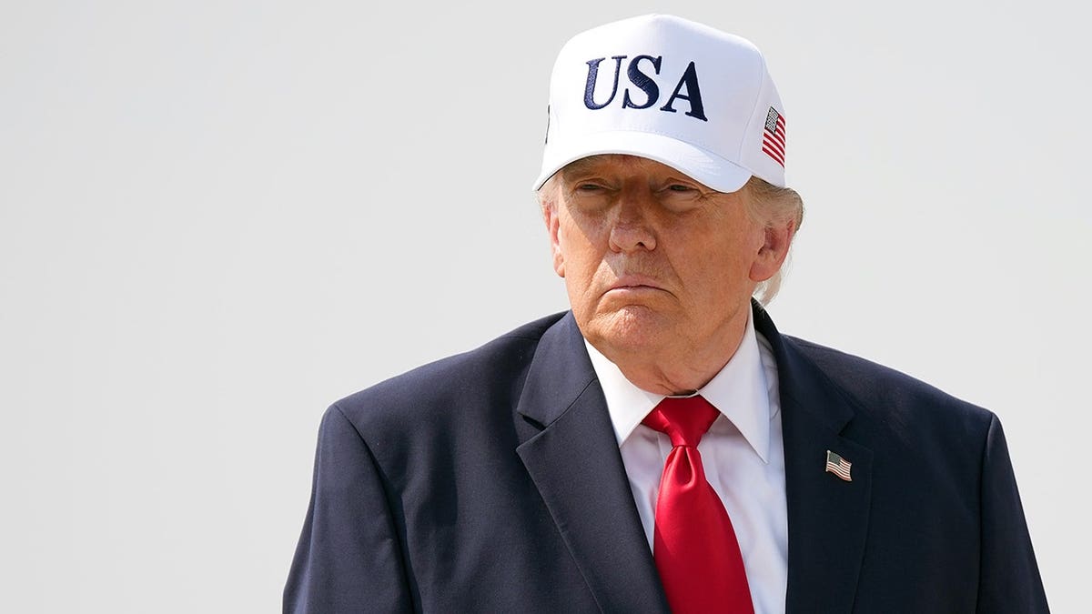 President Donald Trump wearing USA cap