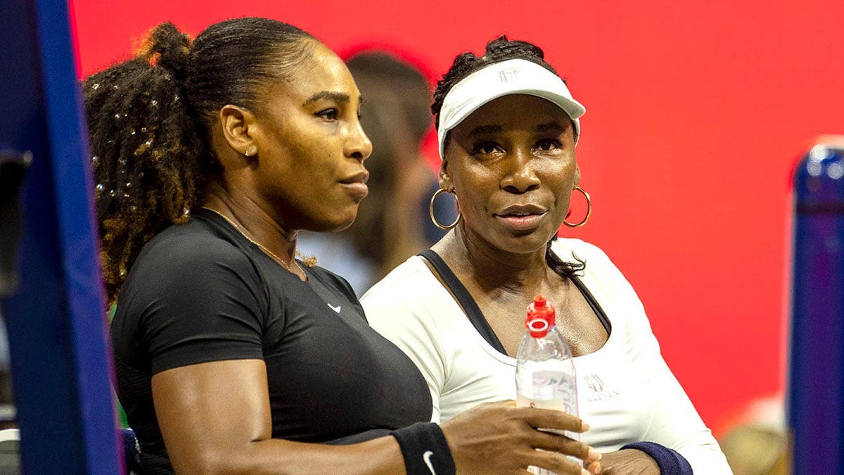 Serena and Venus during match
