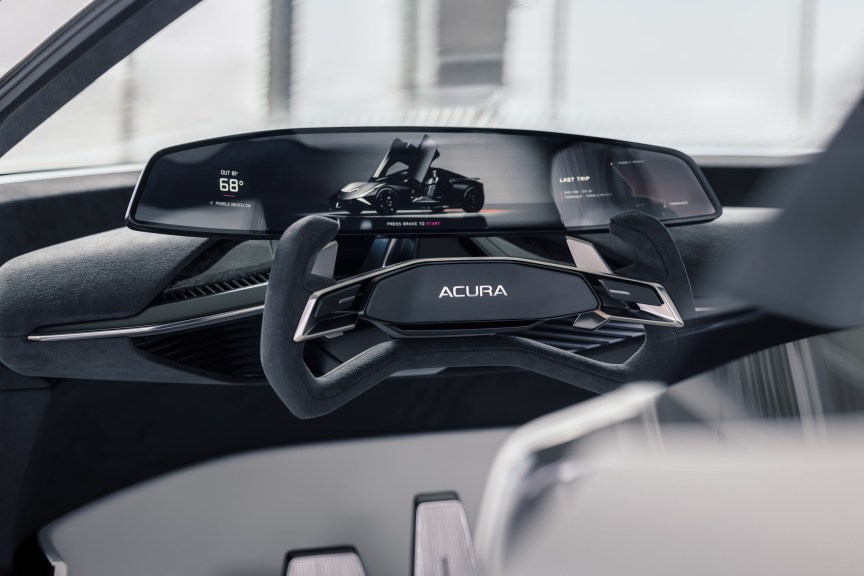Steering yoke and wrap-around instrument cluster