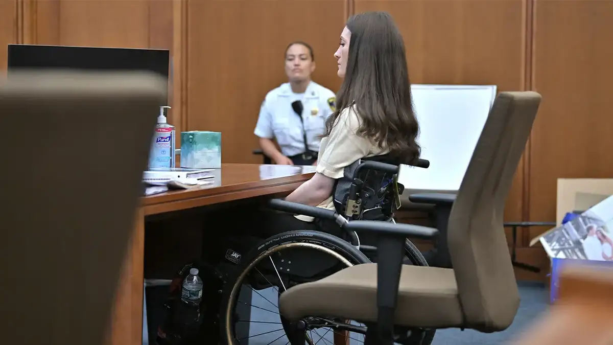 Lindsay Clancy in a wheelchair in court