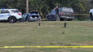 Police fatally shoot sword-wielding man after woman found trapped in car, officials say