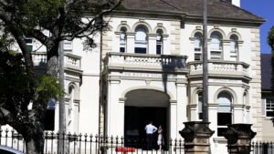Five arrests over threats to Scots College accused