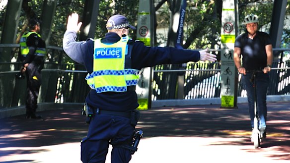 Officers monitor speed and breath-test e-bike users in Brisbane.