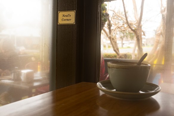 At Thommo’s favourite cafe, run by close friend Anita Cook, a plaque by the bench on the left now reads “Neal’s corner” for his favourite spot where “he could see all the action”, Cook says.