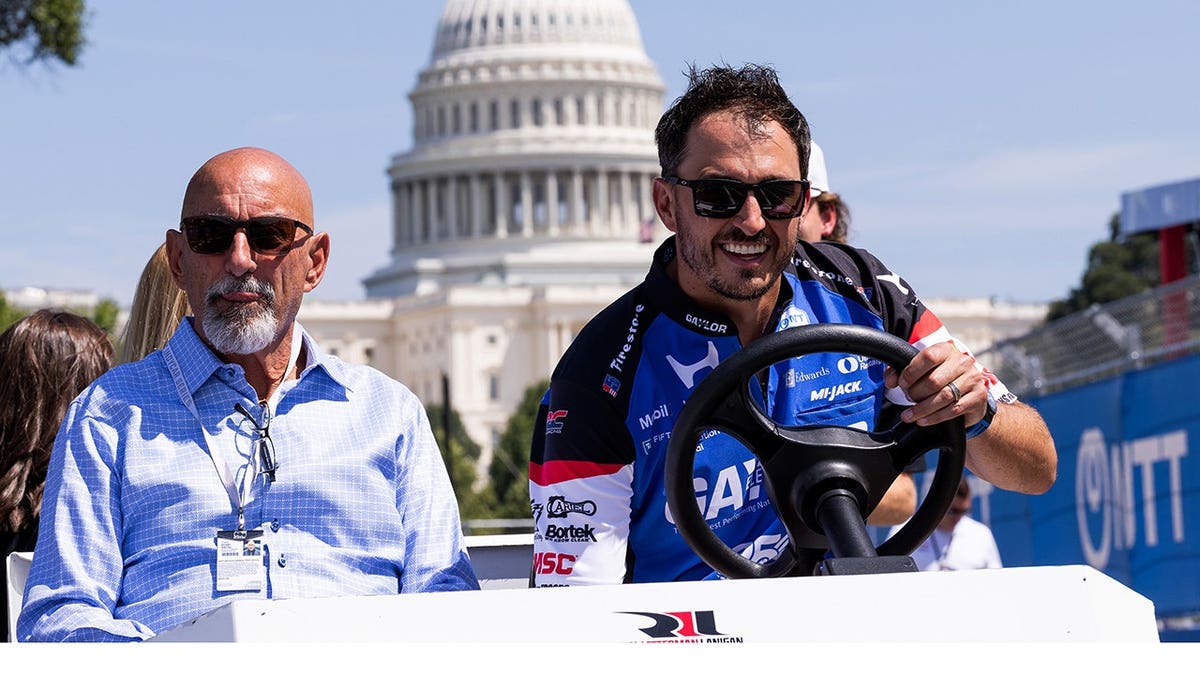 Bobby Rahall and Graham Rahall stand together.