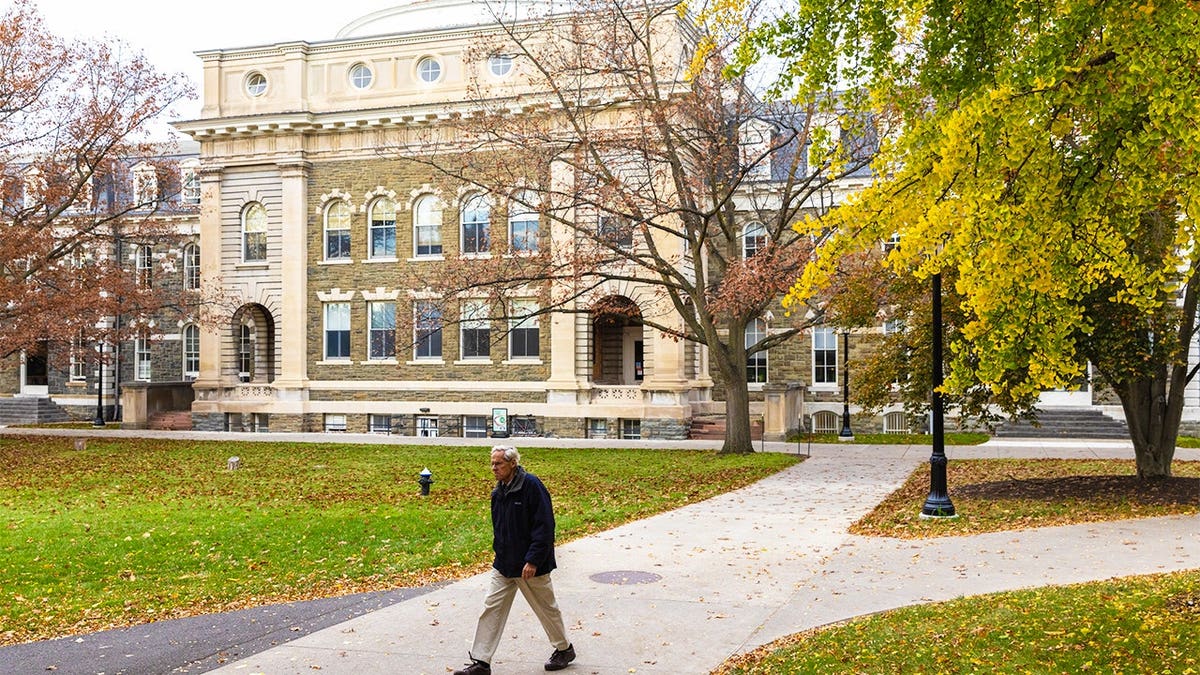 A man walks through the Cornell University campus on November 3, 2023 in Ithaca, New York