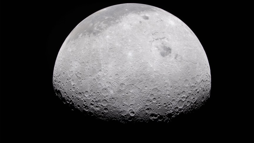 The surface of the moon with a black background.