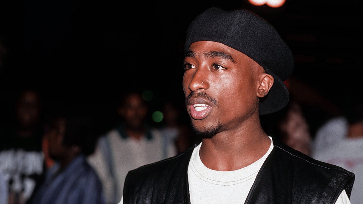Tupac Shakur poses for a photo
