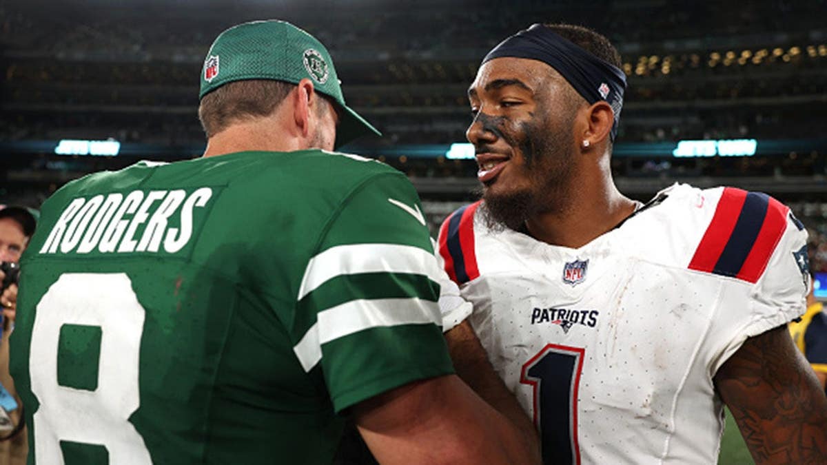 Aaron Rodgers talks with Ja'Lynn Polk after the game at MetLife Stadium.