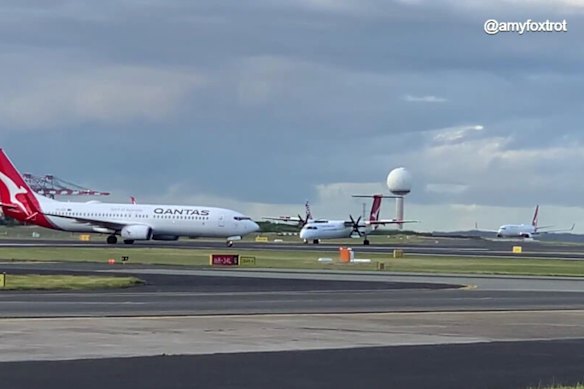 The Boeing 737 (left) and the Bombardier DCH-8 involved in a breakdown of co-ordination at Sydney Airport now under investigation.