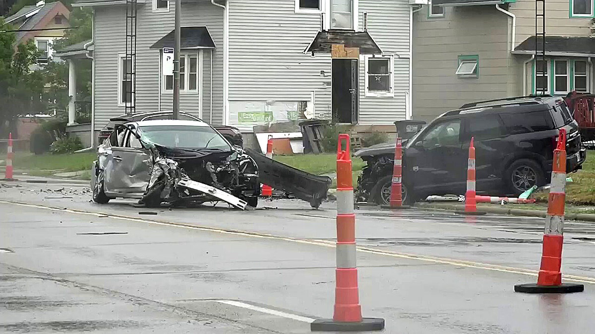 two damaged cars on road