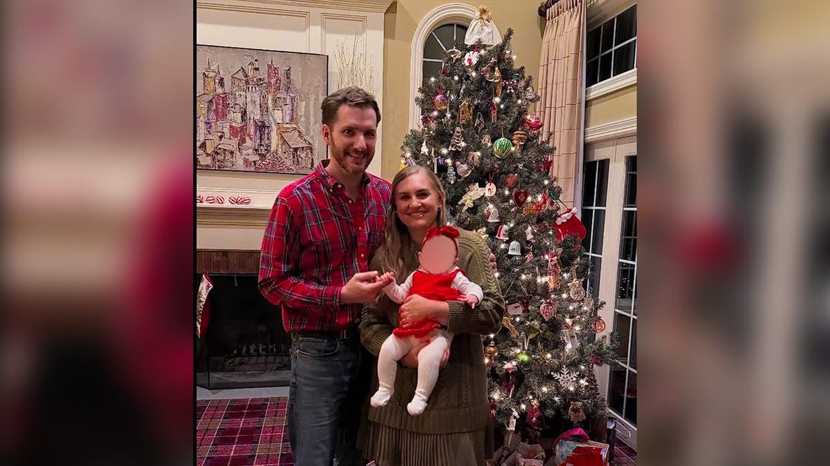Portrait of Brooke Hanlon, with her husband and baby