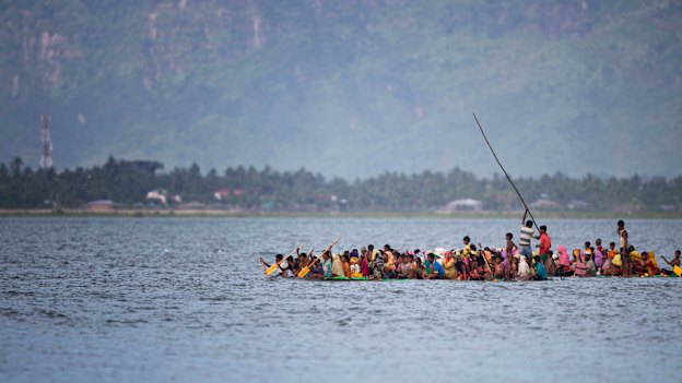 Crowded boats crossed the river.