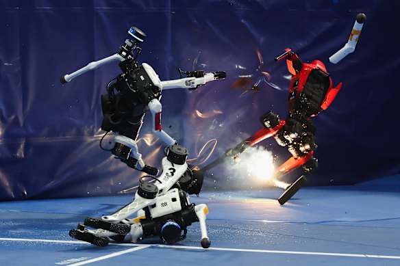 A humanoid robot crashes into a wall and catches fire at the end of the 100-metre race during the 2nd World Humanoid Robot Games in Beijing.