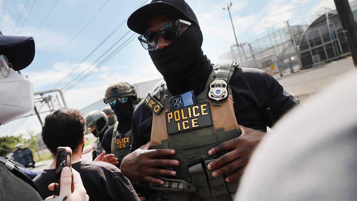 ICE agents outside Delaney Hall