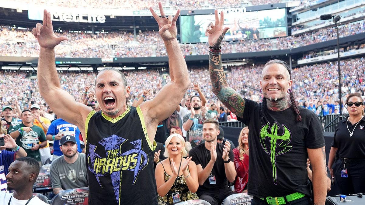 Matt Hardy and Jeff Hardy sitting in the audience at MetLife Stadium.