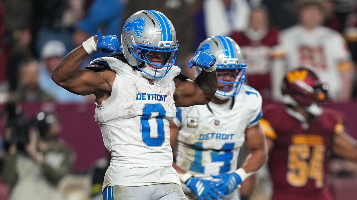Jahmyr Gibbs celebrates