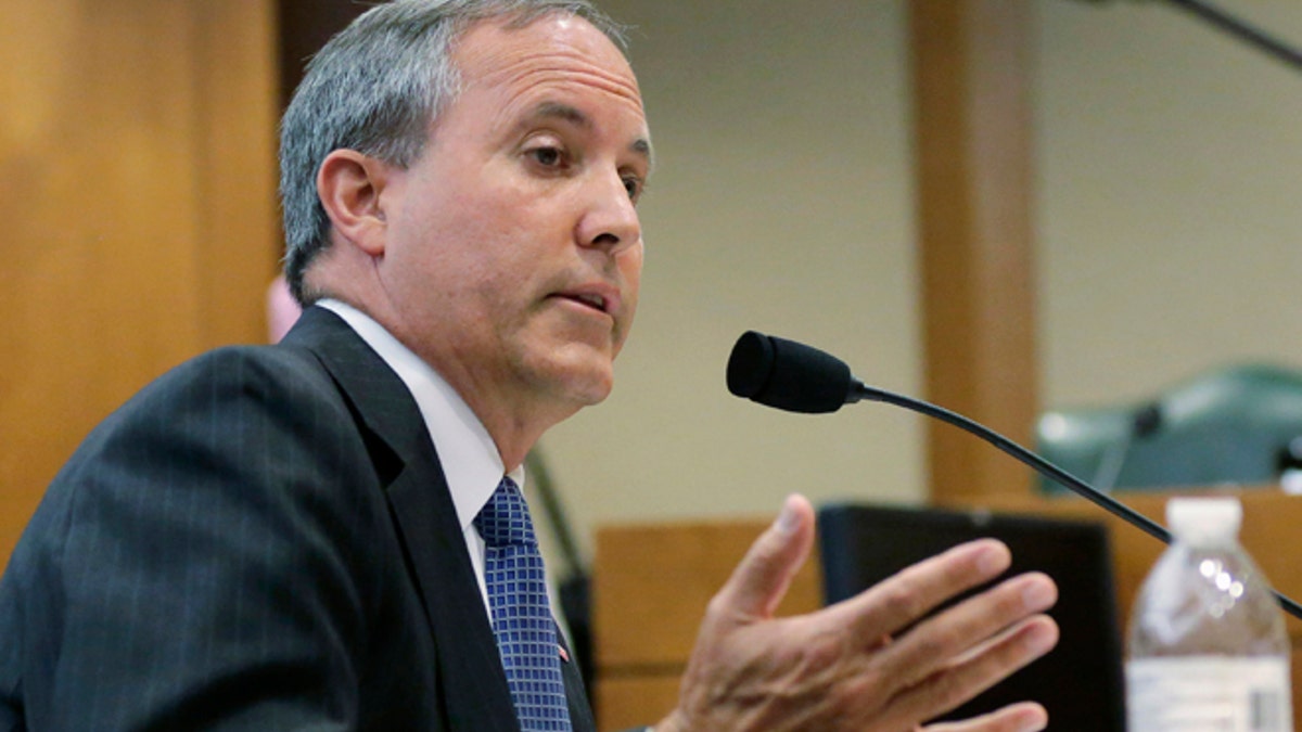 FILE - In this July 29, 2015 file photo, Texas Attorney General Ken Paxton speaks during a hearing in Austin, Texas. A federal judge on Thursday, March 2, 2017, dismissed the U.S. government's securities fraud lawsuit against Paxton, though the Republican still faces criminal charges of duping wealthy investors. (AP Photo/Eric Gay, File)