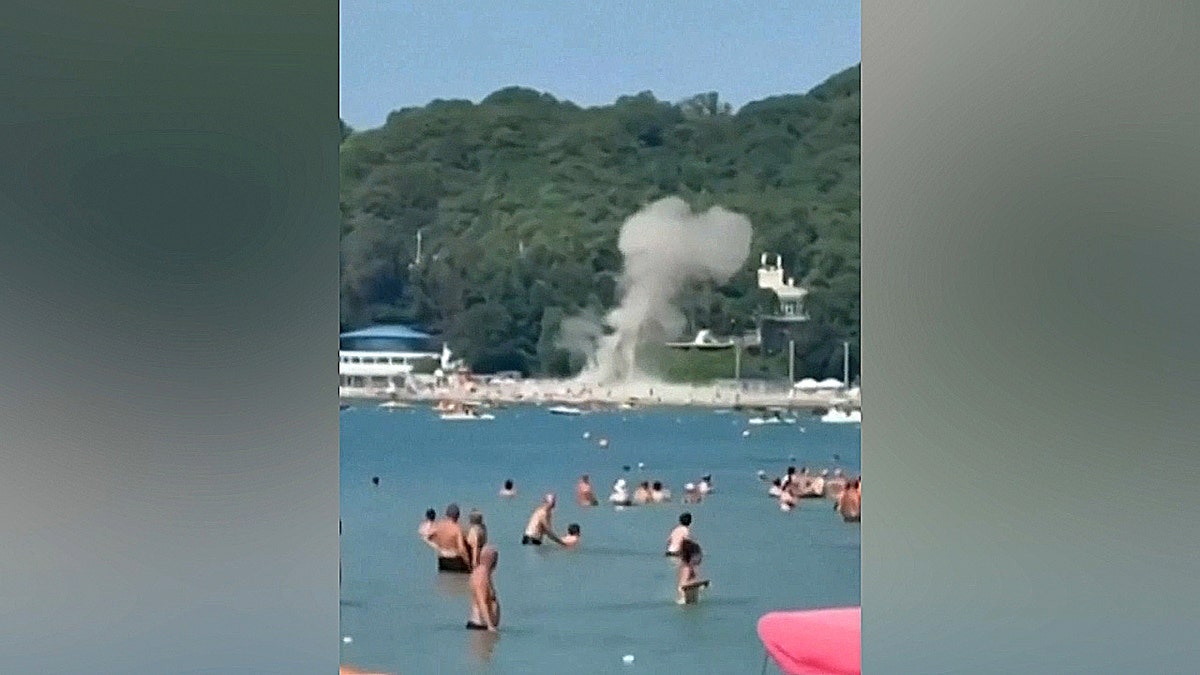 Plume of smoke over beach
