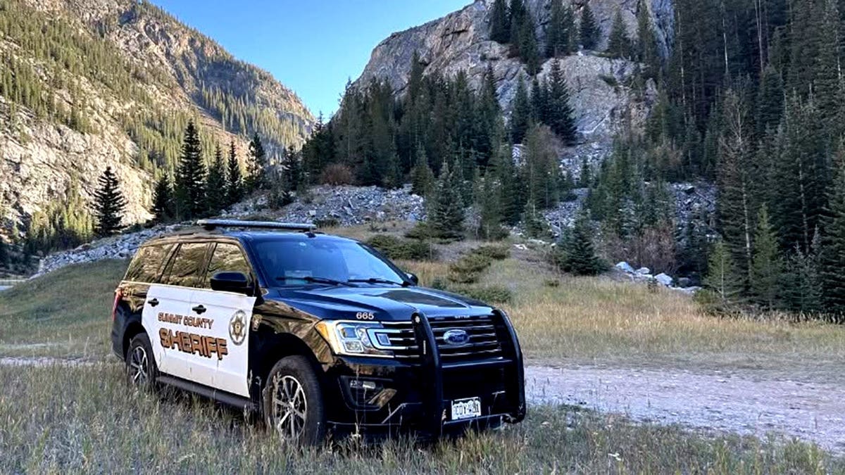 A Summit County sheriff’s patrol car in a mountainous area