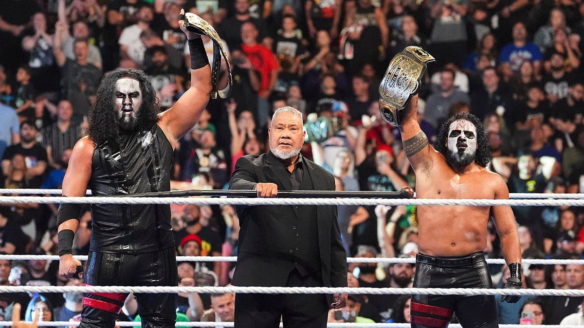 Talla Tonga and Tama Tonga celebrate with Haku at TD Garden.