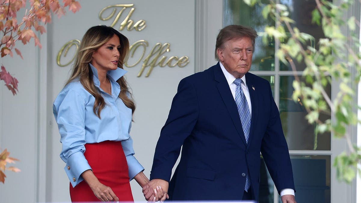Donald Trump and Melania Trump arrive at the White House Rose Garden.