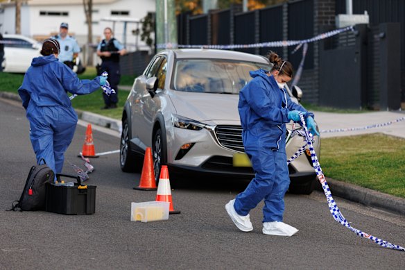 Officers at the scene of the deadly shooting.