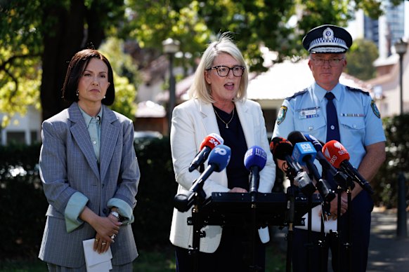 Police Minister Yasmin Catley, centre and Commissioner Mal Lanyon speaking on Thursday after two mistaken identity killings.