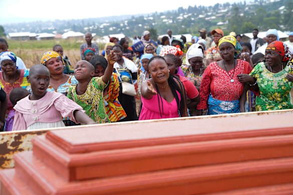 Relatives cry during the burial ceremony of Abineno Justine, a 38-year-old woman who died of the Ebola virus, in Bunia, Democratic Republic of Congo, earlier this month.