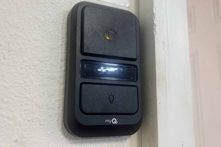 Chamberlain wall mounted garage controller on drywall.