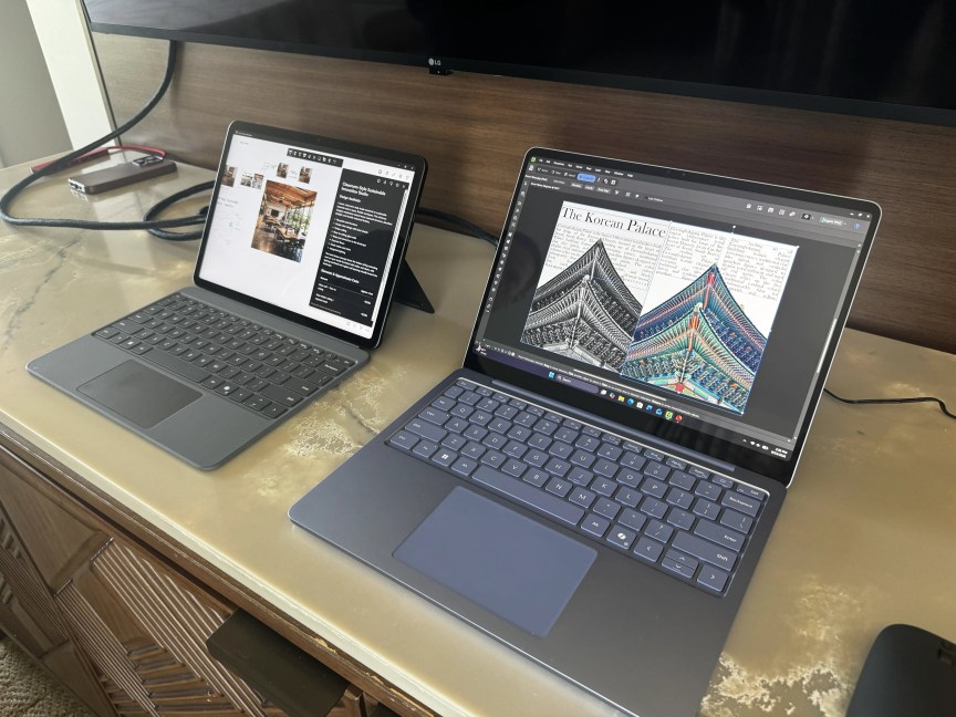 A 2-in-1 laptop and a conventional laptop on a desk.