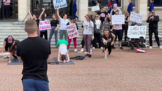 Incoming One Nation MP watching a protest against him on his first visit to Parliament House.